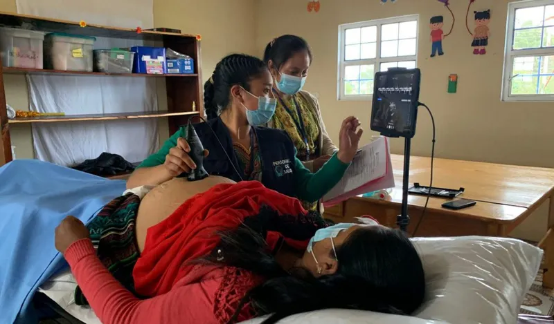 A low-cost handheld Doppler ultrasound device used during a prenatal visit.