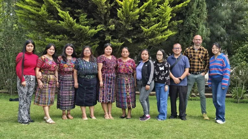 The K'ASLEM study team outside, several members wearing traje típico.